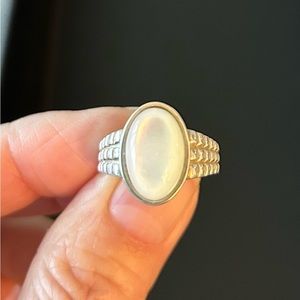 Silver ring with white oval stone